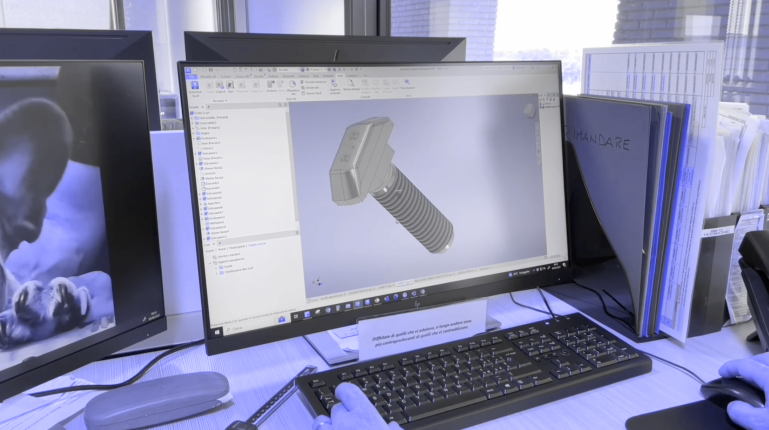 A computer screen displaying a 3D CAD model of a fastener bolt, part of the 3D printing process from prototyping to machine production, used on the related services page.